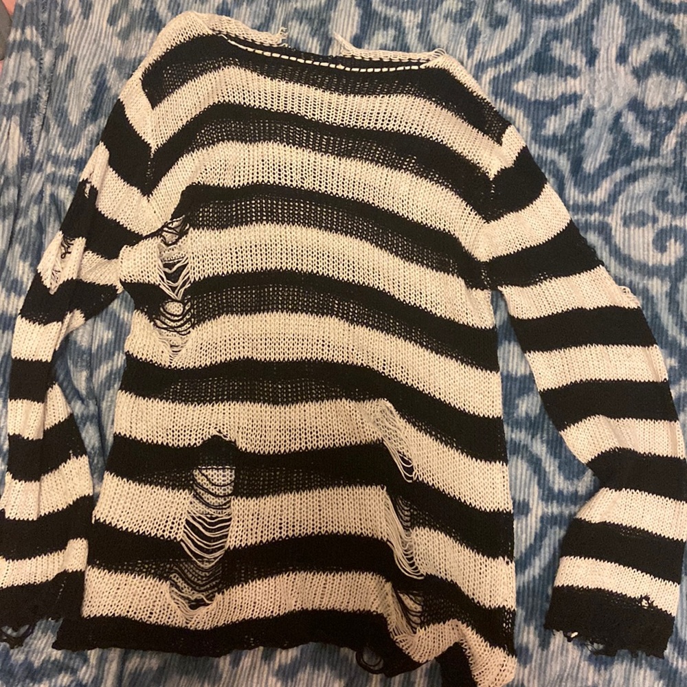 Striped knit long sleeve shirt with rips